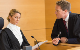 Lawyer speaking with the judge in the court room